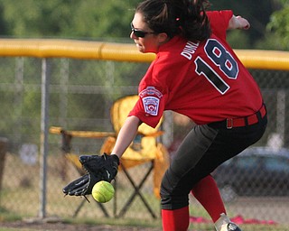 Nikos Frazier | The Vindicator..Canfield's Brianna Dunlap(18) misses a catch a ball in right field during the Junior League district title game at the Field of Dreams in Boardman.