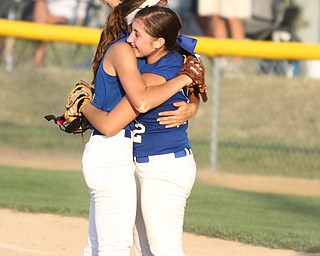 Nikos Frazier | The Vindicator..Camryn Latttanzio(right) and Brooke Bobbey(left) celebrate after winning the Junior League district title game against Canfield at the Field of Dreams in Boardman.