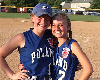 Nikos Frazier | The Vindicator..Poland's Lauren Sienkiewicz(left) and Adeline Schwas(right) pose for a photo after winning the Junior League district title game at the Field of Dreams in Boardman.