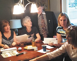 SPECIAL TO THE VINDICATOR
Austintown Fitch High School Class of 1971 will celebrate its 45th class reunion Sept. 3. Preparing the invitations for mailing, from left, are Marsha Clarke Knight, Susie Wertz Blackburn, Fred Hingel, Sharon Ray Roth and Marti Morgan Smith. The event will begin at 6 p.m. and will be hosted by Suzy (Roof) and Steve Coman at their home in Berlin Center. There will be yard games, trivia, a disc jockey, basket auction and a 50-50 raffle. The meal will be catered by the Fifth Season. Take your own beverages. Classmates hope to attend the football game Sept. 2 and plan to attend Canfield Fair on Sept. 4. Tickets are $30 per person or $50 per couple. Contact Mary Brown at 330-770-6253 or marykbrown@zoominternet.net.