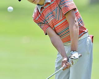 Jeff Lange | The Vindicator  THU, JUL 7, 2016 - Warren JFK's Jimmy Graham watches his chip onto the No. 7 fairway during Thursday's Greatest Golfer of the Valley Junior qualifier held at Salem Hills Golf Club.