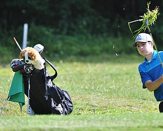 Michael Butch of Ursuline watches his shot from the rough during Wednesday's 2016 Flynn Auto Group Junior Greatest Golfer of the Valley tournament Wednesday at Mill Creek South Course. Butch placed U-17...--Jeff Lange | The Vindicator  WED, JUN 29, 2016