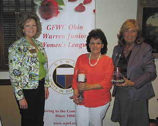 SPECIAL TO THE VINDICATOR
GFWC Ohio Warren Junior Women’s League Second Vice President and Membership Chairman Becky Bucco, left, recognized Jan Elliot for 15 years membership and WJWL President Mary Lou Jarrett for 10 years membership. Each was presented with an etched glass candle holder.
