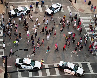Protesters march during a Black Live Matter rally in downtown Dallas on Thursday, July 7, 2016. Multiple media outlets report that shots were fired later Thursday during the protest over two recent fatal police shootings of black men. (Smiley N. Pool | The Dallas Morning News via AP)