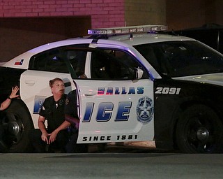 Dallas police respond after shots were fired during a protest over recent fatal shootings by police in Louisiana and Minnesota, Thursday, July 7, 2016, in Dallas. Snipers opened fire on police officers during protests; several officers were killed, police said. (Maria R. Olivas | The Dallas Morning News via AP)