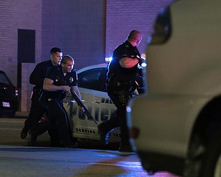 Dallas police respond after shots were fired  during a protest over recent fatal shootings by police in Louisiana and Minnesota, Thursday, July 7, 2016, in Dallas. Snipers opened fire on police officers during protests; several officers were killed, police said. (Maria R. Olivas | The Dallas Morning News via AP)