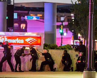 Dallas Police respond after shots were fired at a Black Lives Matter rally in downtown Dallas on Thursday, July 7, 2016. Dallas protestors rallied in the aftermath of the killing of Alton Sterling by police officers in Baton Rouge, La. and Philando Castile, who was killed by police less than 48 hours later in Minnesota. (Smiley N. Pool | The Dallas Morning News via AP)