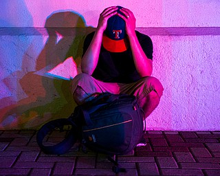 A man reacts after gunmen opened fire during a protest on Thursday, July 7, 2016 in Dallas.  Snipers opened fire on police officers in the heart of Dallas during protests over two recent fatal police shootings of black men.    (Ashley Landis | The Dallas Morning News via AP)