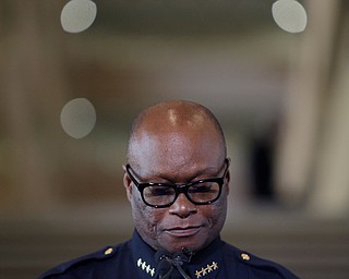 Dallas Police Chief David Brown collects himself while talking about Thursday night's shooting during a news conference, Friday, July 8, 2016, in Dallas.  Snipers opened fire on police officers in the heart of Dallas Thursday night, during protests over two recent fatal police shootings of black men. (Mark Mulligan | Houston Chronicle via AP)