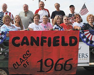 SPECIAL TO THE VINDICATOR
The graduating Canfield High School class of 1966 joined in Canfield’s Fourth of July parade to add to the celebration of their 50th reunion. Classmates attending the event included, standing from left, Bob Minkler, Tom Cummings, Ed Anderson, Jim Clay, and Dale Rhinehart; and seated, Carol Platek Swartz, Jim Swartz, Nancy Henry Haraburda, Patty Hepplewhite Tabbara, Bonnie Anderson Kellett, Marilee Hedge Morrison, Sue Nelson Latess, Thelma Martz Wise, Bob Mayle, Carol Abblett Ryan and Bill Barnes.