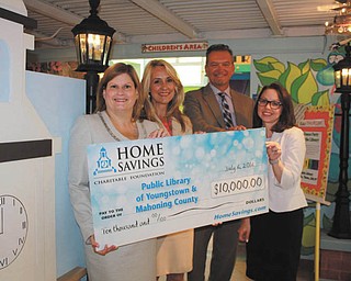SPECIAL TO THE VINDICATOR
Home Savings Charitable Foundation recently donated $10,000 to the Public Library of Youngstown and Mahoning County that will be used to sponsor the breakfast at Stambaugh Auditorium for students who successfully complete the library’s Summer Discover Reading Program. More than 600 children attended the breakfast last year. Barbara Radis, left, senior vice president of retail banking for Home Savings, presented the check to Deborah Liptak, library development director; Timothy Bresnahan, library trustee and chairman of the board development committee; and Heidi Daniel, executive director of the library. For information about the public library, call 330-744-8636 or visit libraryvisit.org.