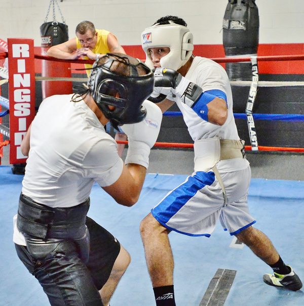 Jeff Lange | The Vindicator  SAT, JUL 9, 2016 - Popo Salinas (right) looks to jab opponent Jake Giuriceo during a sparring match while training at the gym on Market Street on Saturday, July 9, 2016.