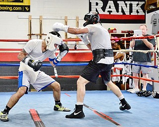 Jeff Lange | The Vindicator SAT, JUL 9, 2016 -Popo Salinas ducks under Jake Giuriceo's punch during a sparring match while training at the gym on Market Street on Saturday, July 9, 2016.