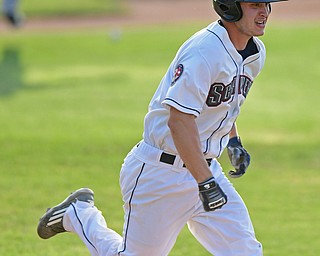 NILES, OHIO - JULY 11, 2016: Michael Tinsley #8 of the Scrappers sprints to first for a bunt single in the second inning of Monday nights game at Eastwood Field. DAVID DERMER | THE VINDICATOR