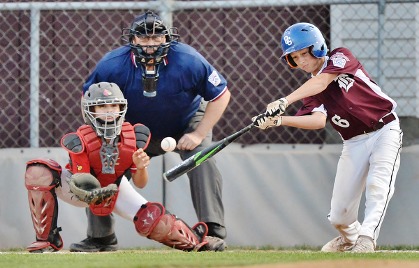Jeff Lange | The Vindicator  MON, JUL 11, 2016 - Boardman's Sean O'Horo (6) takes a swing at a pitch as Canfield catcher Landon Beidelschies looks on in the top of the first inning of Monday's game against Canfield at Field of Dreams in Boardman.