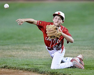 Jeff Lange | The Vindicator  MON, JUL 11, 2016 - Canfield second baseman Drew Carrocce makes a throw to first from his knees after fielding a ground ball sent up the middle in the top of the second inning of Monday's game against Boardman at Field of Dreams in Boardman.