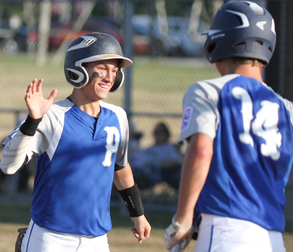 William D. Lewis The Vindicator Poland's Jake Bacon(8) gets hi 5 from Bailey Swogger(14) after scorig in Poland's win over Boardman during July 12, 2016 game with Poland at Field Of Dreams.