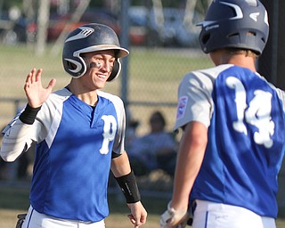 William D. Lewis The Vindicator Poland's Jake Bacon(8) gets hi 5 from Bailey Swogger(14) after scorig in Poland's win over Boardman during July 12, 2016 game with Poland at Field Of Dreams.