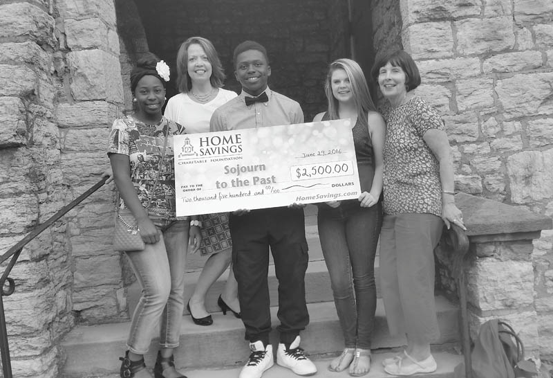 SPECIAL TO THE VINDICATOR
Home Savings Charitable Foundation recently donated a check for $2,500 to Mahoning Valley Sojourn to the Past. The educational program takes students on a 10-day trip through the states of Georgia, Arkansas, Alabama, Mississippi and Tennessee to learn about the 1960s Civil Rights Movement. From left, are Tyra Finley; Trish Mohan, branch manager of Home Savings main office; Brian Finley; Emma Myers; and Penny Wells, director of Sojourn. The funds will be used to enable one student to participate in the program. For information about Sojourn, call 330-788-0545 or visit mvsojourntothepast.com.