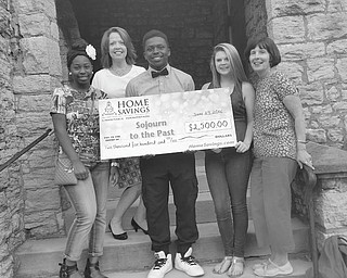 SPECIAL TO THE VINDICATOR
Home Savings Charitable Foundation recently donated a check for $2,500 to Mahoning Valley Sojourn to the Past. The educational program takes students on a 10-day trip through the states of Georgia, Arkansas, Alabama, Mississippi and Tennessee to learn about the 1960s Civil Rights Movement. From left, are Tyra Finley; Trish Mohan, branch manager of Home Savings main office; Brian Finley; Emma Myers; and Penny Wells, director of Sojourn. The funds will be used to enable one student to participate in the program. For information about Sojourn, call 330-788-0545 or visit mvsojourntothepast.com.