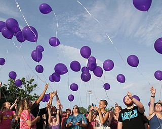 William D. Lewis/The Vindicator  Friends and family of Maddison Pappas, a Fitch HS student who recently died, launch balloons during a July 11,2016 vigil at Fitch HS.