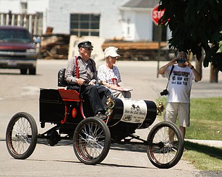        ROBERT K. YOSAY  | THE VINDICATOR..one of the older cars is art and Magaret Morra  in thier 1902 Olds.....Vintage 1 and 2 stroke engines are on tour in the Mahoning Valley - cruise down Newton St in Canfield...42nd  national 1& 2 cylinder tour . - -30-...