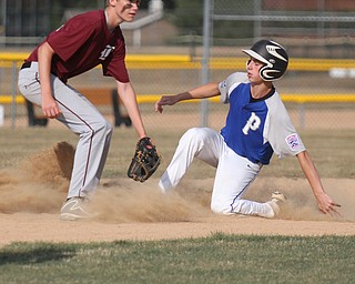 william D. Lewis/The Vindicator  Poland'sStephen Carney steals 2nd while Boardman's Mason Smith (22) waits for the throw during July 13, 2016 game at Field of Dreams.