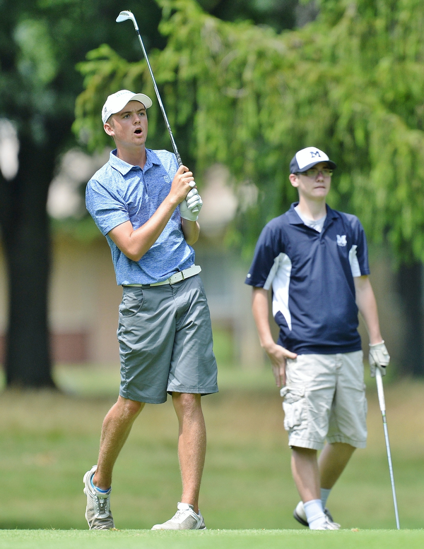Jeff Lange | The Vindicator  THU, JUL 14, 2016 - Cardinal Mooney's Ken Keller (left) reacts as his shot from the No. 5 fairway lands in the water as McDonald's Joey Ragazzine looks on from behind during Thursday's Greatest Golfer of the Valley Junior qualifier held at Trumbull Country Club in Warren.