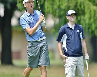 Jeff Lange | The Vindicator  THU, JUL 14, 2016 - Cardinal Mooney's Ken Keller (left) reacts as his shot from the No. 5 fairway lands in the water as McDonald's Joey Ragazzine looks on from behind during Thursday's Greatest Golfer of the Valley Junior qualifier held at Trumbull Country Club in Warren.
