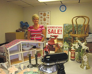 SPECIAL TO THE VINDICATOR
Alzheimer Network volunteers are preparing to host its annual garage sale from 9 a.m. to 3 p.m. Thursday and Friday and from 9 to 11 a.m. next Saturday at Western Reserve United Methodist Church, 4580 Canfield Road. Hundreds of items will be available at bargain prices. Looking over recent items donated is Cindy LaBuda, AlzNet board member. The Alzheimer Network is a nonprofit organization that provides 12 free monthly family support groups in the area as well as numerous educational seminars for caregivers. For information on Alzheimer’s disease or about the sale, call the network information line at 330-788-9755.
