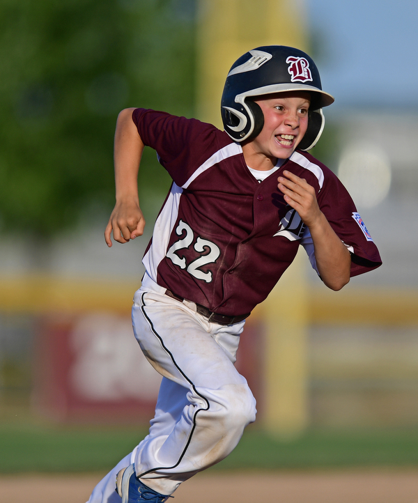 BOARD MAN, OHIO - JULY 15, 2016: Caleb Satterfield(22) of Boardman sprints to third base on a RBI single by Ryan Conti(20) in the third inning of Friday evenings District 2 9/10 year old Little League Championship game at the Field of Dreams. Boardman would go on to win 18-5. DAVID DERMER | THE VINDICATOR