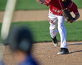 BOARDMAN, OHIO - JULY 19, 2016: Starting pitcher Ryan Petro #12 of Canfield delivers in the first inning of their game Tuesday night at the Fields of Dreams. Hamilton West won 2-0. DAVID DERMER | THE VINDICATOR
