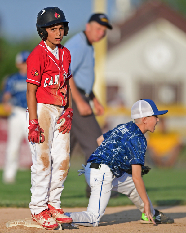 BOARDMAN, OHIO - JULY 19, 2016: Base runner Tony Pannunzio #6 of Canfield shows his frustration after being forced out at second base by short stop Cayden Evans #1 of West Hamilton after a line drive was caught by the second basemen in the fourth inning of their game Tuesday night at the Fields of Dreams. Hamilton West won 2-0. DAVID DERMER | THE VINDICATOR