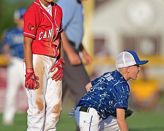 BOARDMAN, OHIO - JULY 19, 2016: Base runner Tony Pannunzio #6 of Canfield shows his frustration after being forced out at second base by short stop Cayden Evans #1 of West Hamilton after a line drive was caught by the second basemen in the fourth inning of their game Tuesday night at the Fields of Dreams. Hamilton West won 2-0. DAVID DERMER | THE VINDICATOR
