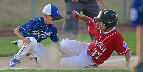 BOARDMAN, OHIO - JULY 19, 2016: Jake Grdic #17 of Canfield slides safely into third base beating the tag from Charlie Vidourek #2 of West Hamilton in the fifth inning of their game Tuesday night at the Fields of Dreams. Hamilton West won 2-0. DAVID DERMER | THE VINDICATOR