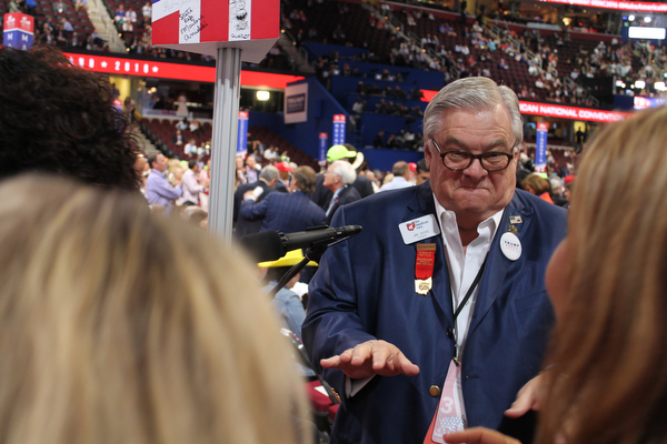 Jim Dicke, an at-large Ohio delegate at the Republican National Convention, dances to start the Wednesday evening session..