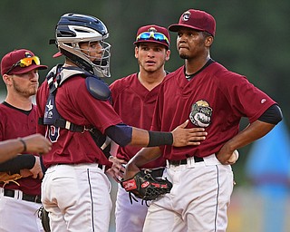 NILES, OHIO - JULY 21, 2016: Starting pitcher Juan Hillman #25 of the Scrappers is consoled by catcher Gian Paul Gonzalez #16 before being removed in the fourth inning of their game Thursday night at Eastwood Field. DAVID DERMER | THE VINDICATOR
