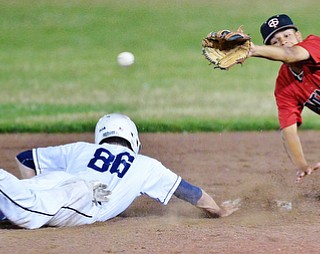 Jeff Lange | The Vindicator  THU, JUL 21, 2016 - Baird base runner Jarret Lyon (86) dives safely back to second as Ontario second baseman Reilly Walters fails to catch the throw from home in the fifth inning of Thursday's game at Cene Park.