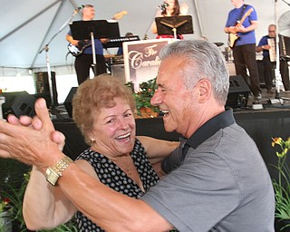 William d. Lewis The vindicator  Dancing to the sounds of  The Cavaliers are Rose Moses and Vincent Bellaiuto of New Castle during Mt Carmel Festival in Youngstown July 22, 2016.