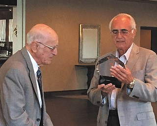 SPECIAL TO THE VINDICATOR
Children’s Mental Health Circle of Friends Foundation awarded the 2016 Crystal Heart Award to Ed DiGregorio, former educator and Youngstown State University girls basketball coach, July 10 at the Lake Club in Poland. The award is given to individuals who through their professional career, personal dedication and/or volunteerism, or through philanthropy have contributed to the development and enrichment of children and young adult lives in the Mahoning Valley. Greg Cvetkovic, right, president of the Children’s Circle of Friends Foundation, presented the award to DiGregorio.