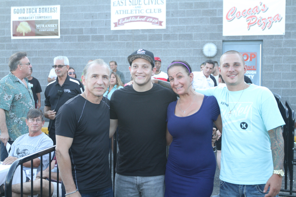 Nikos Frazier | The Vindicator..Ray "Boom Boom" Mancini, Mike Boker, Stacy Keller, and Leo Mancini pose for a photo before the South Side Boxing Club Championship Night at the Covelli Center.