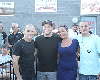 Nikos Frazier | The Vindicator..Ray "Boom Boom" Mancini, Mike Boker, Stacy Keller, and Leo Mancini pose for a photo before the South Side Boxing Club Championship Night at the Covelli Center.