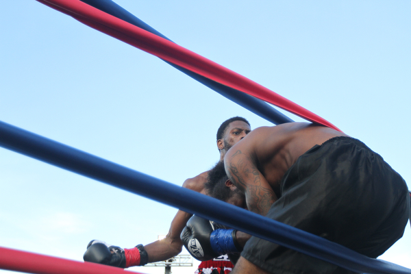 Nikos Frazier | The Vindicator..Fred Wilson of Cleveland and Rakin Johnson of Indianapolis, Ind. battle in the second round of the first bout of the South Side Boxing Club Championship Night at the Covelli Center.