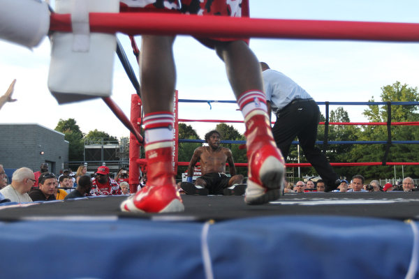 Nikos Frazier | The Vindicator..Rakin Johnson lays against the ropes after tripping in the third round of the first bout at the South Side Boxing Club Championship Night at the Covelli Center.