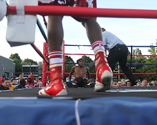 Nikos Frazier | The Vindicator..Rakin Johnson lays against the ropes after tripping in the third round of the first bout at the South Side Boxing Club Championship Night at the Covelli Center.