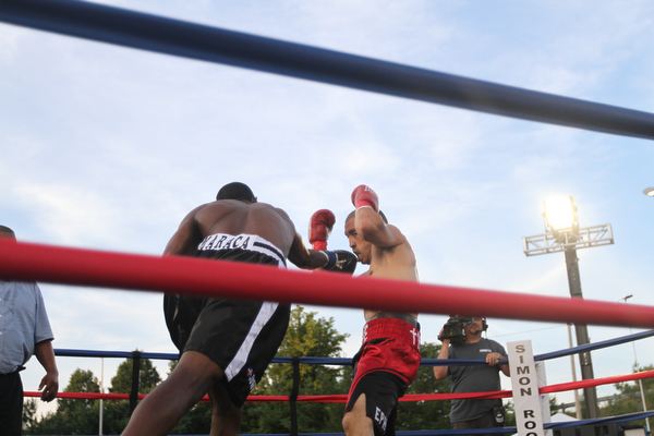 Nikos Frazier | The Vindicator..Jake "The Bull" Giuriceo(right) dodges a swing from Jose Abrue in the second round at the South Side Boxing Club Championship Night at the Covelli Center.