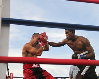 Nikos Frazier | The Vindicator..Jose Abrue(right) makes contact with Jake "The Bull" Giuriceo in the third round at the South Side Boxing Club Championship Night at the Covelli Center.