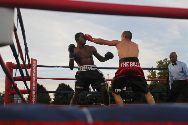 Nikos Frazier | The Vindicator..Jake "The Bull" Giuriceo(right) swings at Jose Abrue in the fifth round at the South Side Boxing Club Championship Night at the Covelli Center.