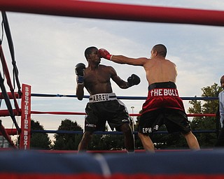 Nikos Frazier | The Vindicator..Jake "The Bull" Giuriceo(right) swings at Jose Abrue in the fifth round at the South Side Boxing Club Championship Night at the Covelli Center.