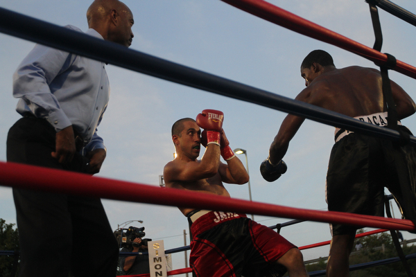 Nikos Frazier | The Vindicator..Jake "The Bull" Giuriceo(right) dodges a swing from Jose Abrue in the sixth round at the South Side Boxing Club Championship Night at the Covelli Center.